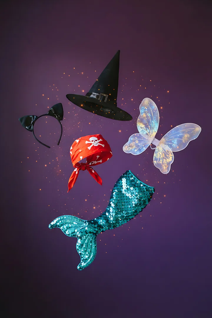 What Should You Be for Halloween? A playful studio photograph on a solid deep purple background